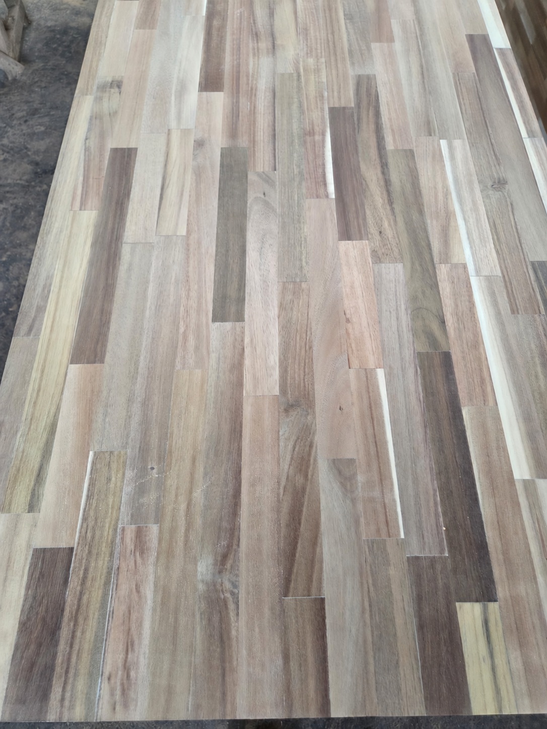 Close view of an unfinished finger-jointed panel surface