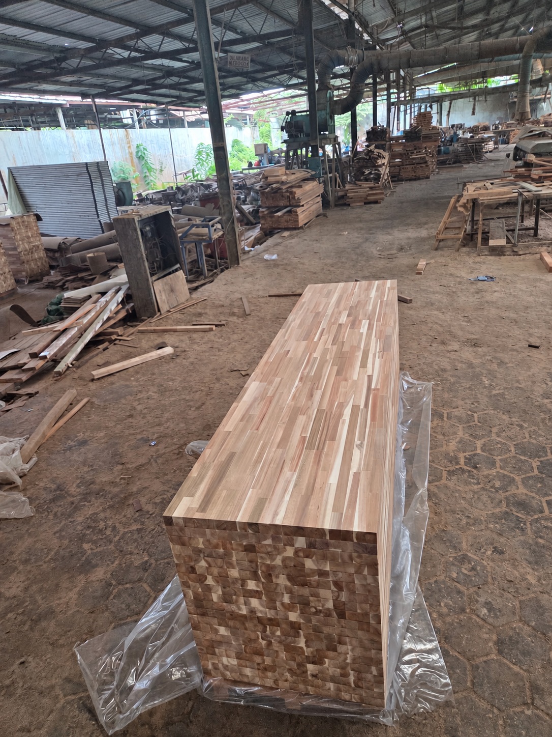 Indonesian wood production workshop with panel materials and equipment